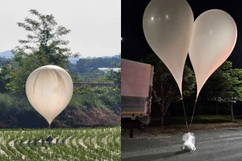 Fotos de balões com sacos de lixos pendurados chegando à Coreia do Sul